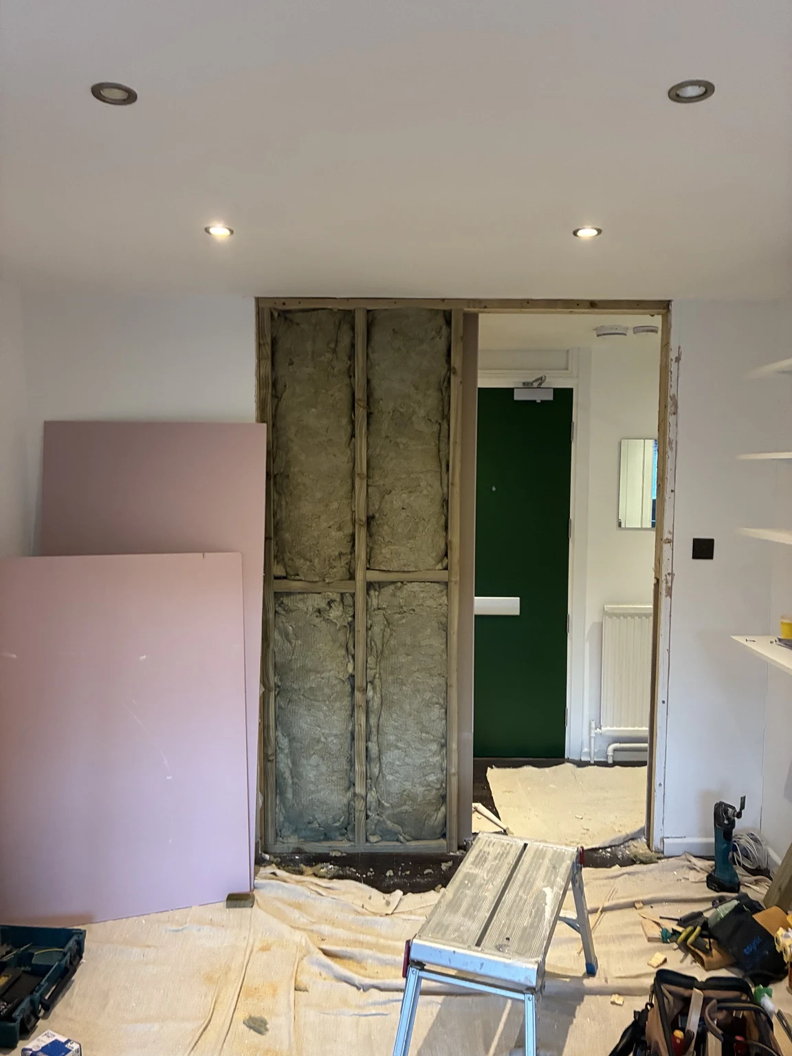 Interior renovation with exposed wall and plasterboard