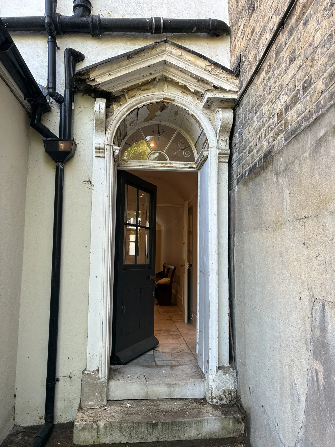 Period entrance and front door before restoration